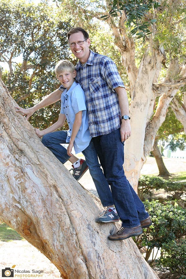 father and son portrait on a tree